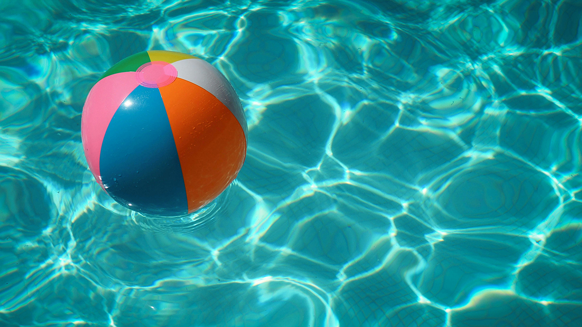 A beachball floating in a pool